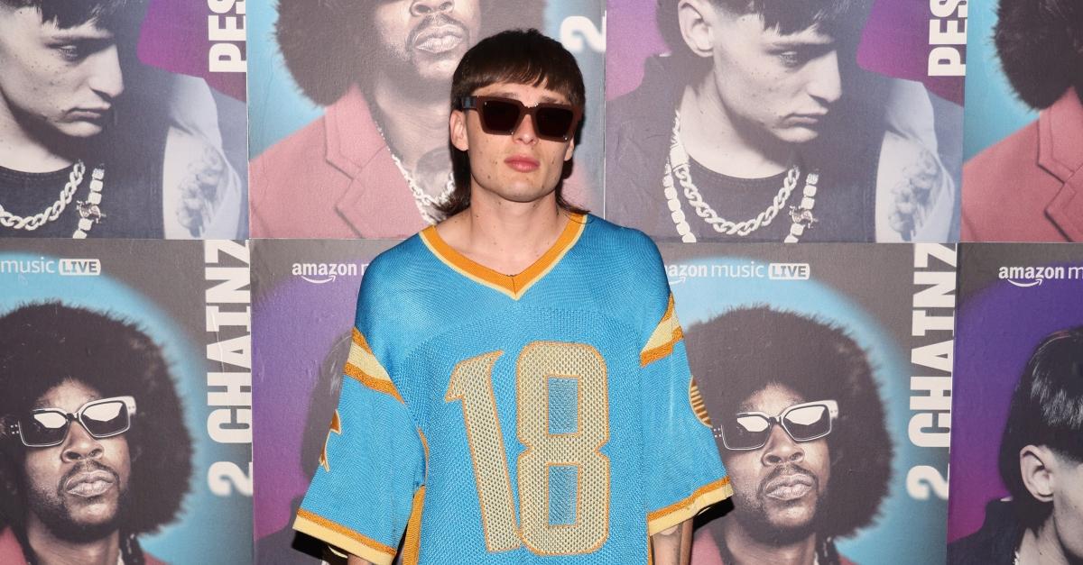 Peso Pluma wears yellow and blue jersey and attends Amazon Music Live Concert Series 2023 on October 19, 2023 in Los Angeles, California.