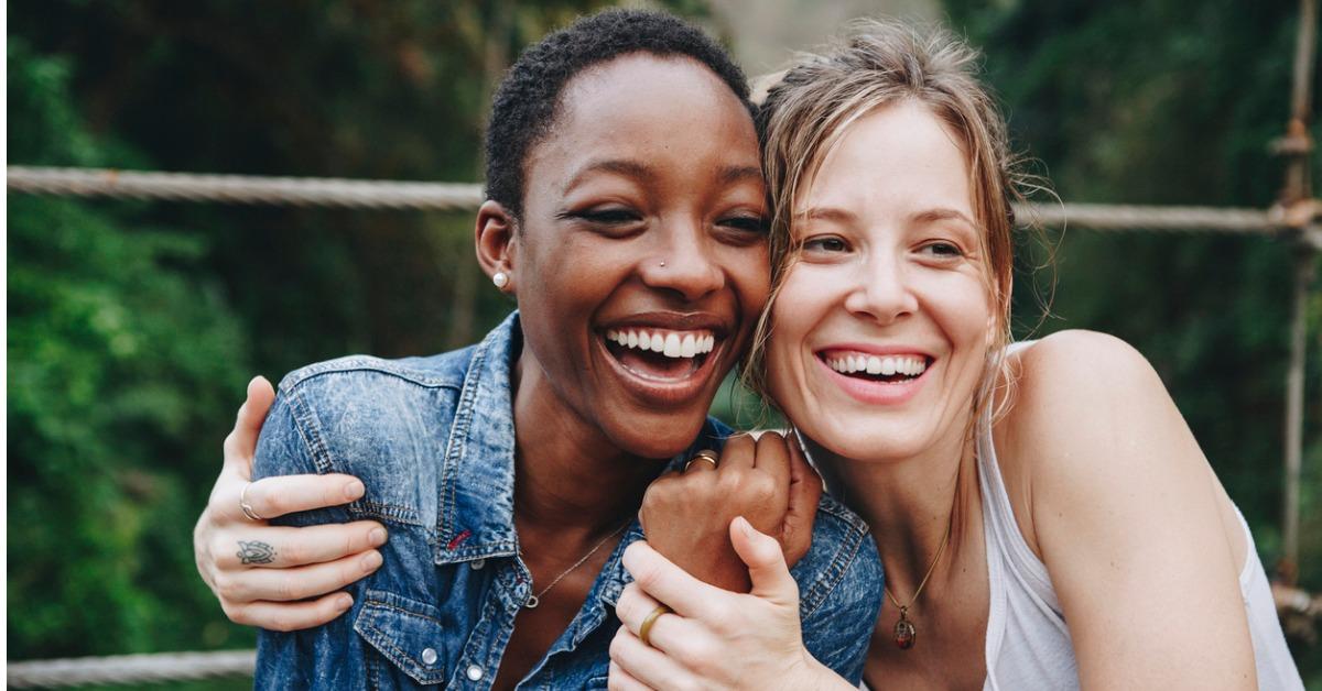 happy women hugging each other picture id