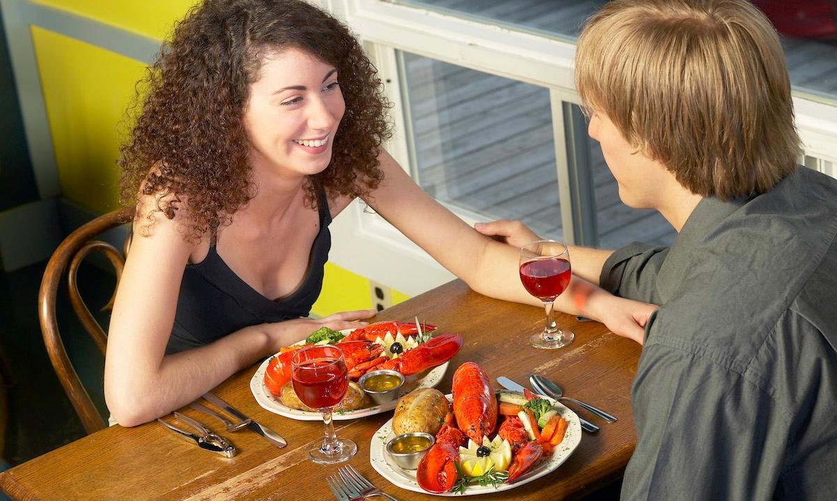 A couple enjoying a seafood meal