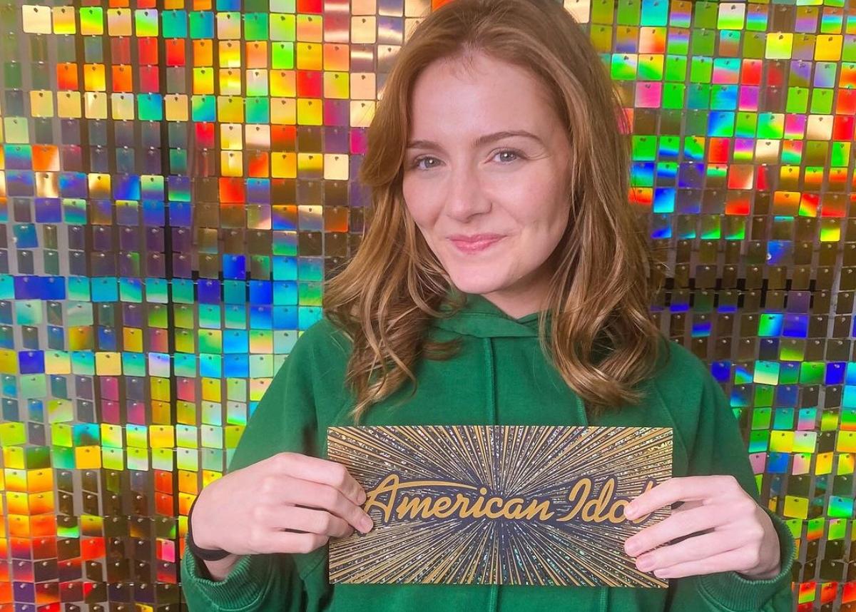 Emmy Russell holds her ticket to Hollywood on American Idol