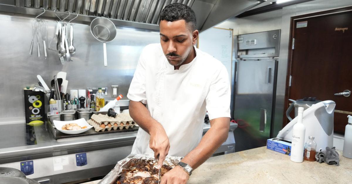 Chef Johnathan "Jono" Shillingford slicing food on Season 9 of 'Below Deck Mediterranean.'