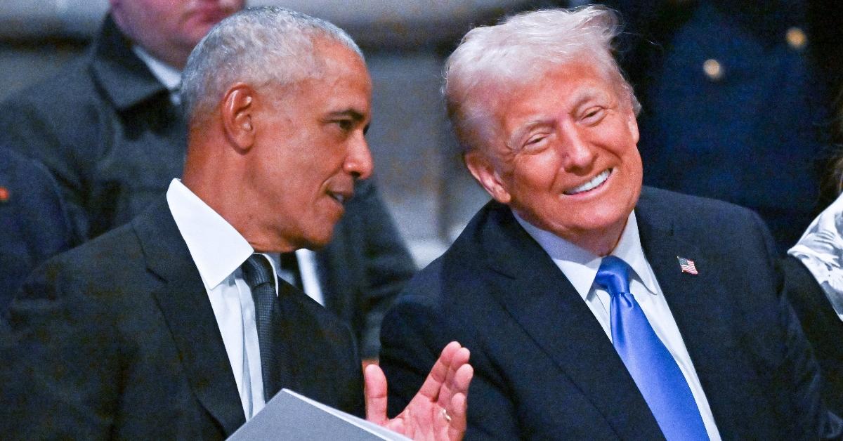 Former president Barack Obama talks to President Donald Trump