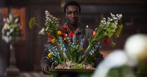 Cyril carrying a flower arrangement in 'Call the Midwife'