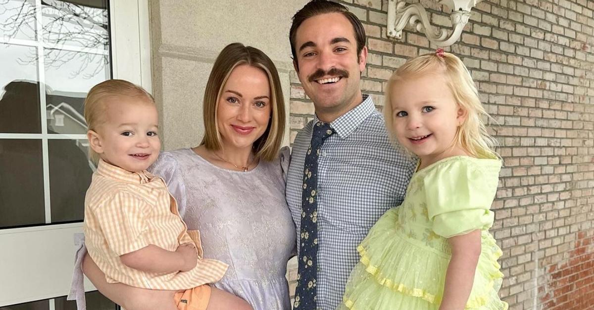 Whitney Leavitt with her husband and kids outside of their home