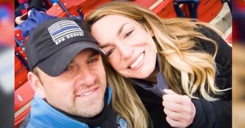 John O'Keefe and Karen Read take a picture at a baseball game