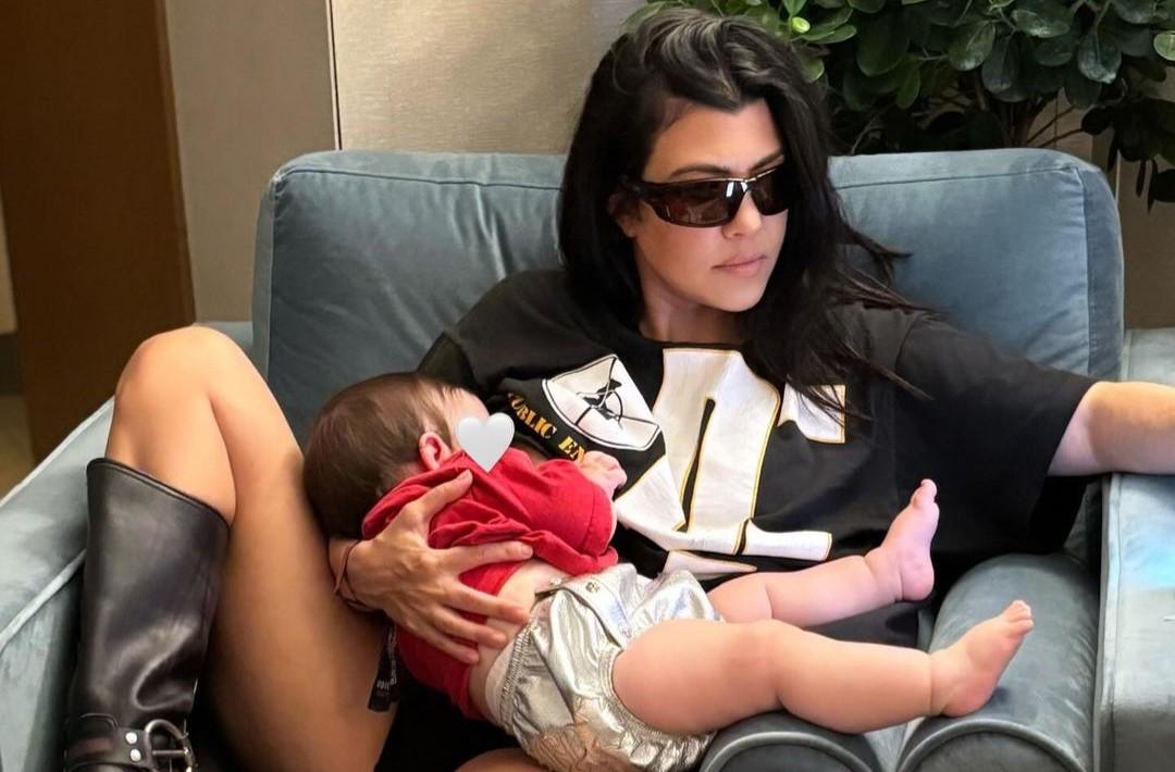 Kourtney Kardashian holding her son Rocky