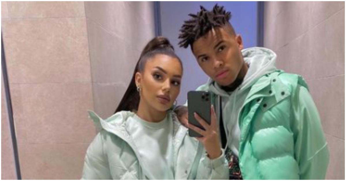 (l-r): Miona Bell and Jibri Bell posing together while wearing mint-colored puffer coats.