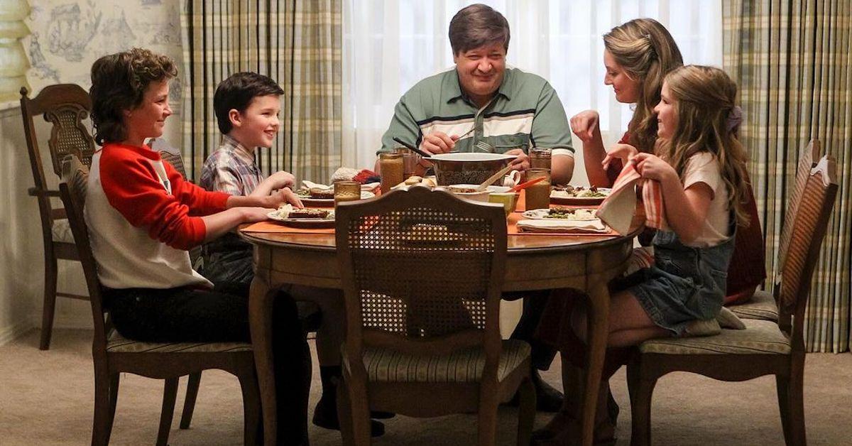 The Cooper family sits at the dinner table together on 'Young Sheldon'.