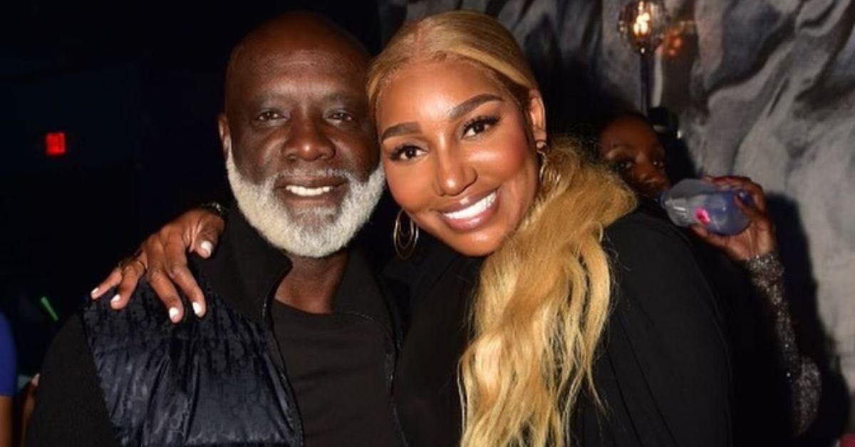 (l-r): Peter Thomas and NeNe Leakes embracing at an event.