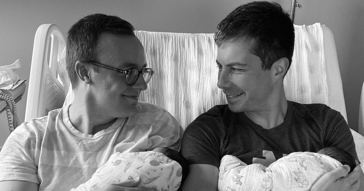 Pete Buttigieg (R) with his husband Chasten Buttigieg (L) and their twin children