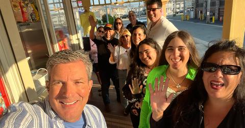 Bob Kelly takes a selfie with fans sporting a cut on his cheek.