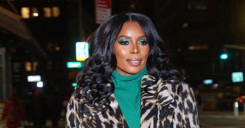 Tasha Smith in a leopard print jacket