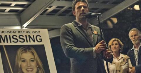 Nicholas Dunne is front of a missing persons poster in 'Gone Girl'.