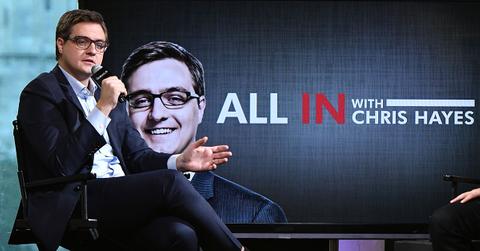 Chris Hayes speaking into a mic on stage.