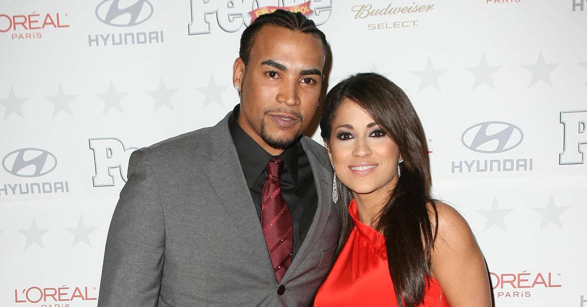 Don Omar (L) and Jackie Guerrido pose during arrivals at the People en Espanol star of the year celebration on December 12, 2007 in Miami, Florida