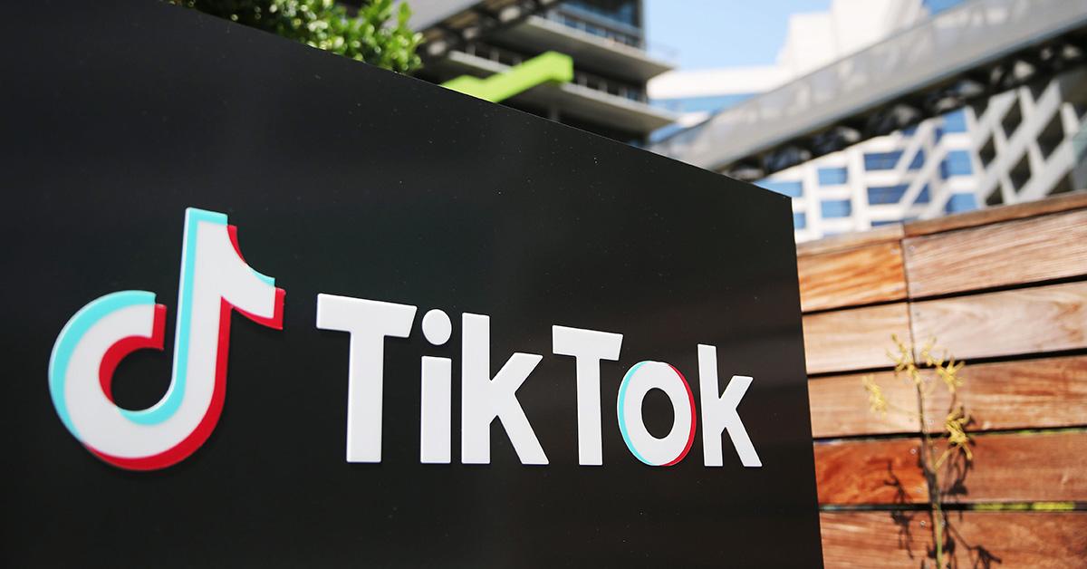 The TikTok logo on a wall outside. 