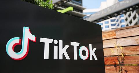 The TikTok logo on a wall outside.