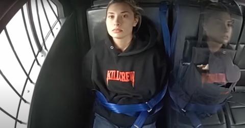 Christina Formella in the back of a police car