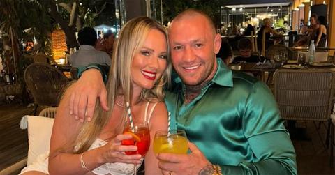 Dee Devlin and Conor McGregor with drinks in their hands.