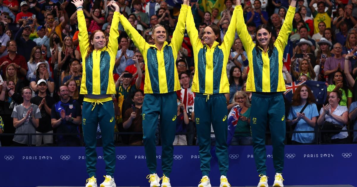 NANTERRE, FRANCE - JULY 27: Gold Medalists, Mollie O'Callaghan, Shayna Jack, Emma McKeon and Meg Harris of Team Australia acknowledge the fans during the Medal Ceremony after the Women's 4x100m Freestyle Relay Final on day one of the Olympic Games Paris 2024 at Paris La Defense Arena on July 27, 2024 in Nanterre, France. (Photo by Maddie Meyer/Getty Images)