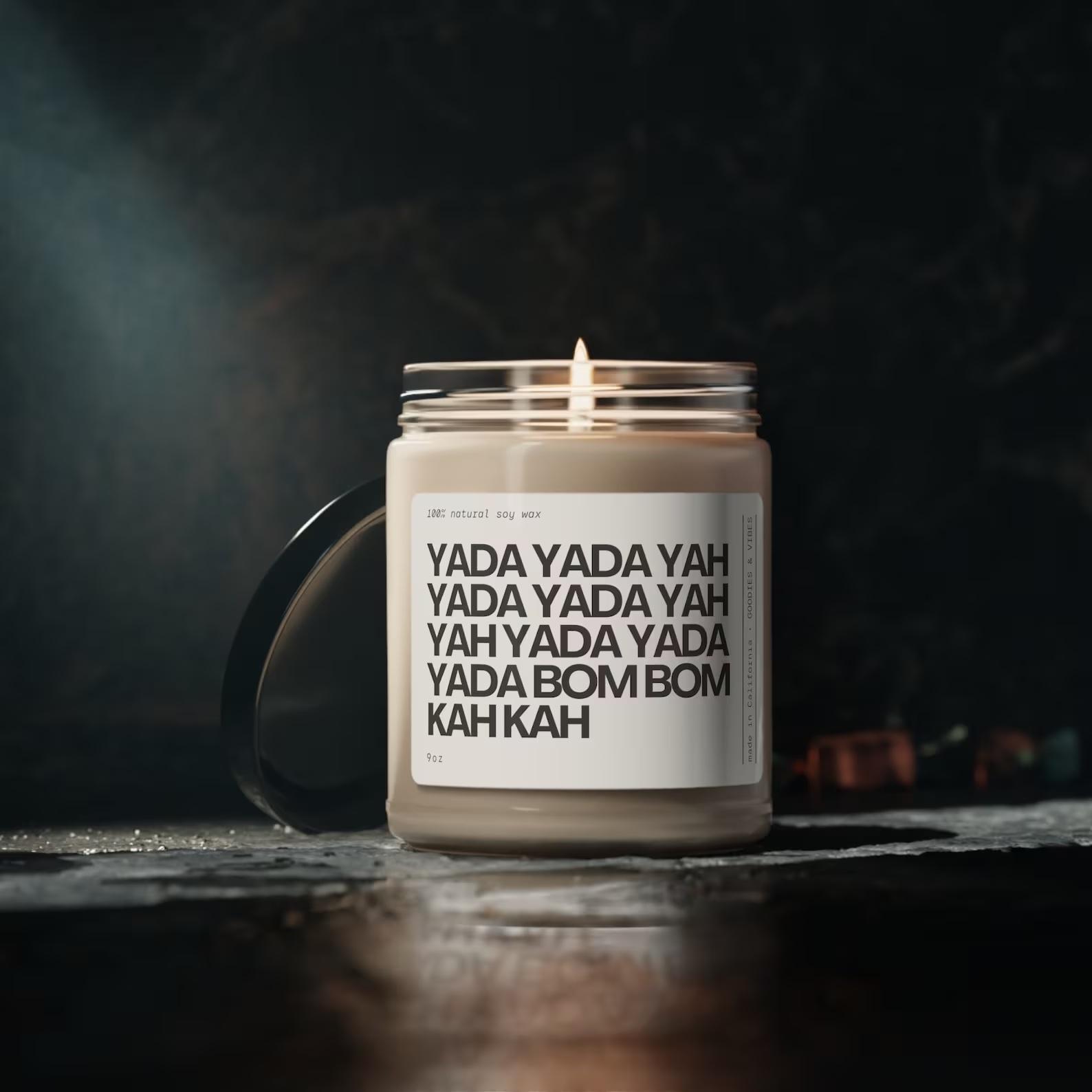 A candle that says "yada yada yah yada yada yah yah yada yada yada bom bom kah kah"