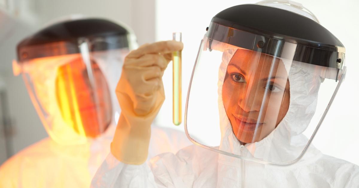 woman examining test tube 