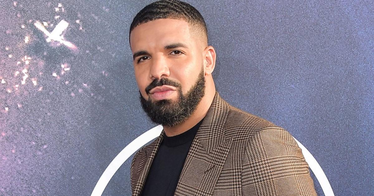 Drake posing for a press photo