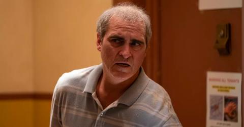 Beau (Joaquin Phoenix) nervously looks around the corner in 'Beau Is Afraid'