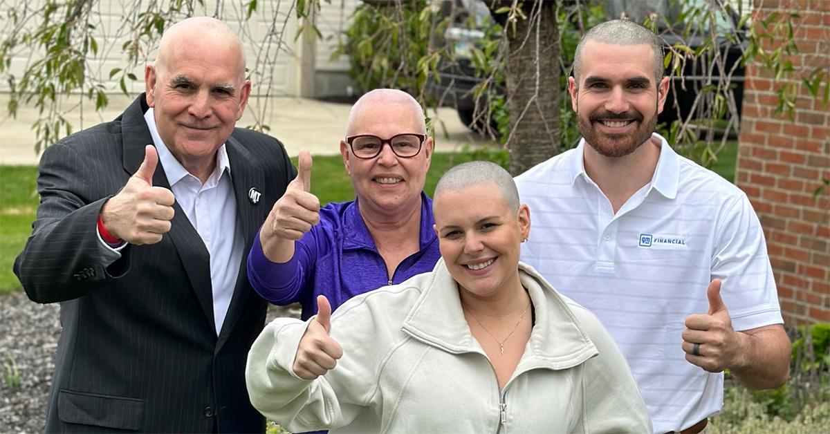 Dom Tiberi and his family with shaved heads. 