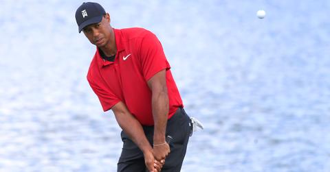 Tiger Woods hits out of the sand trap on the 15th hole during the final round of the TOUR Championship on Sept. 23, 2018