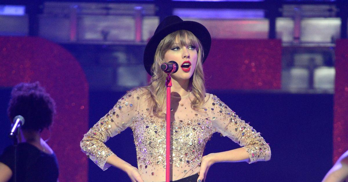 Taylor Swift during her original 'Red' era wearing the hat that would eventually become the inspiration for the Eras Tour '22' hat