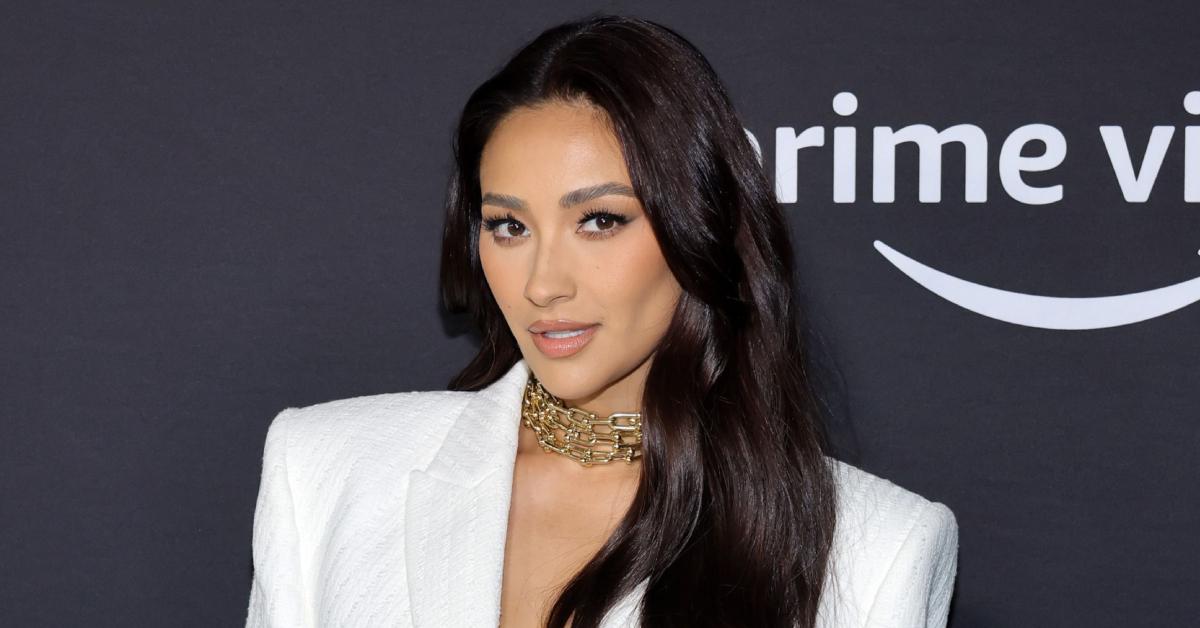 Shay Mitchell dons a white pantsuit to the premiere of Prime Video's 'Something From Tiffany's' on Nov. 29, 2022