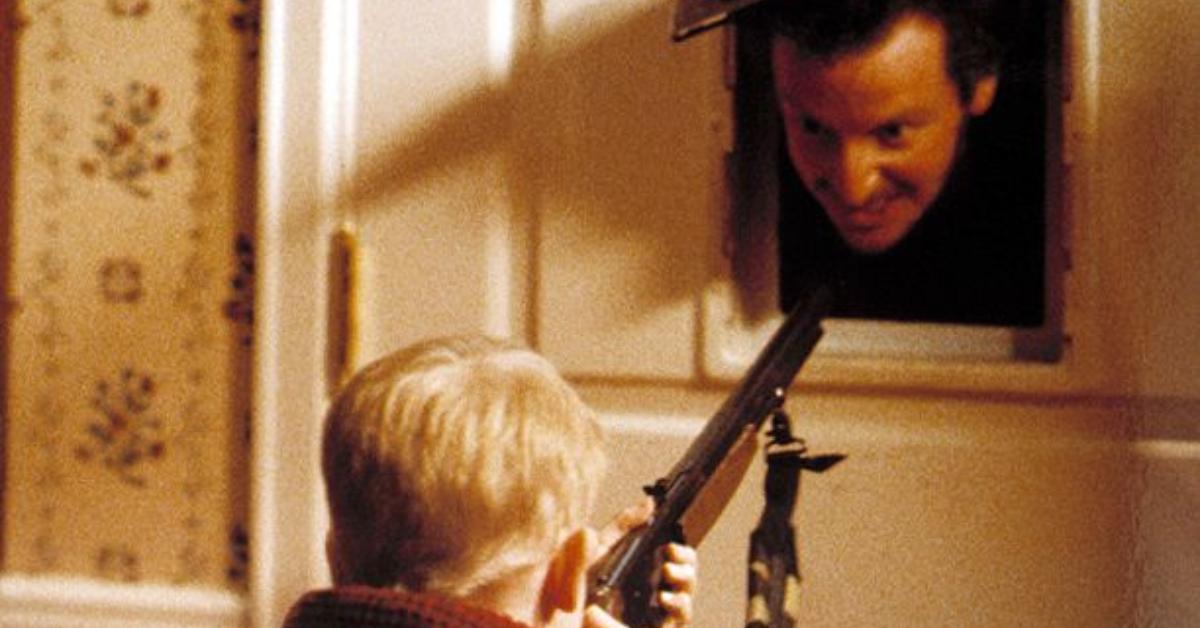 Kevin aims his BB gun at Marv in Home Alone