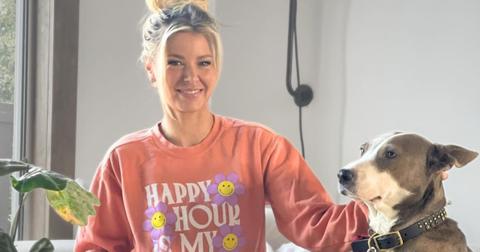 Ariana Madix with her dog Mya on a couch