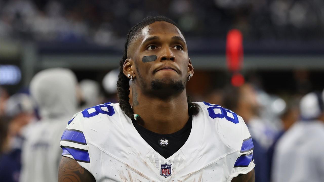 CeeDee Lamb on the sidelines during the Dallas Cowboys and Green Bay Packers game on Jan. 14, 2024