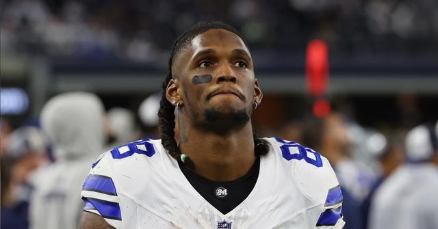 CeeDee Lamb on the sidelines during the Dallas Cowboys and Green Bay Packers game on Jan. 14, 2024