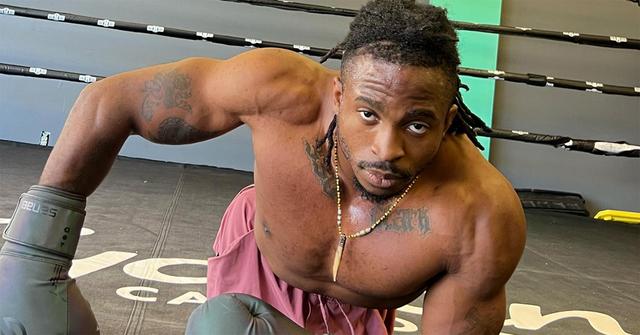 Zion Clark in a boxing ring with gloves on.