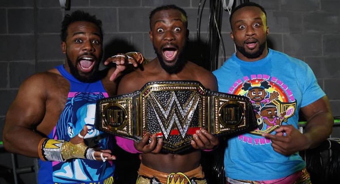 Xavier Woods, Kofi Kingston, and Big E holding a WWE championship belt