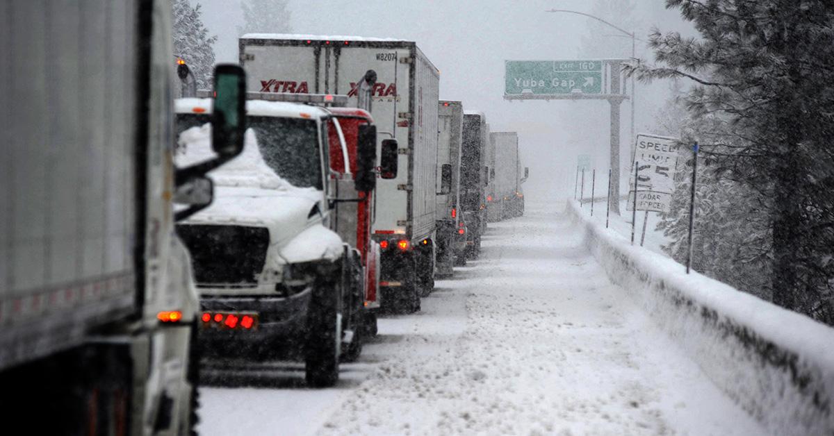 Trucks stuck in traffic because of a snowstorm.