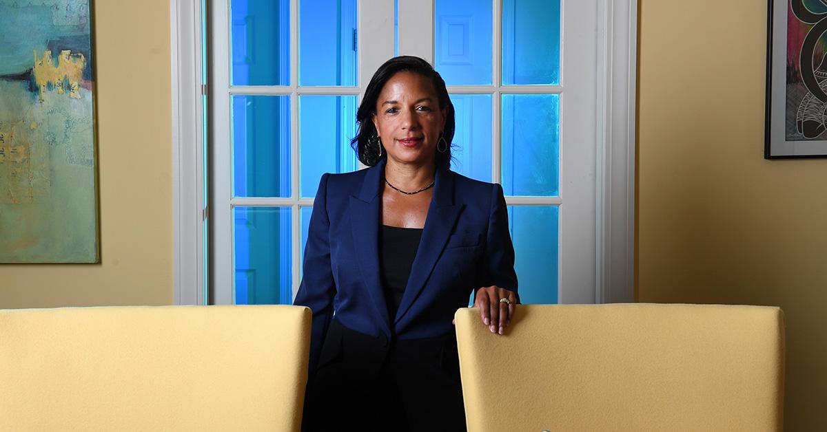 Susan Rice with a hand on a chair in front of a doorway. 