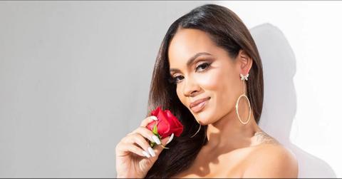 Evelyn Lozada holding a red rose.