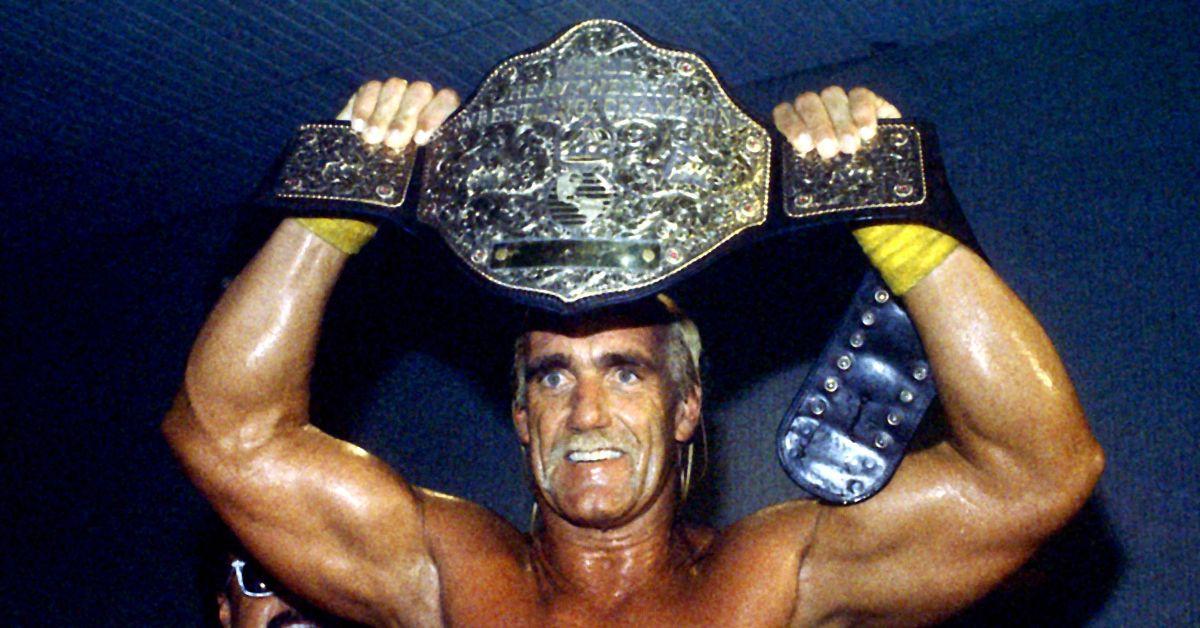 Hulk Hogan holding a championship belt in 1994. 