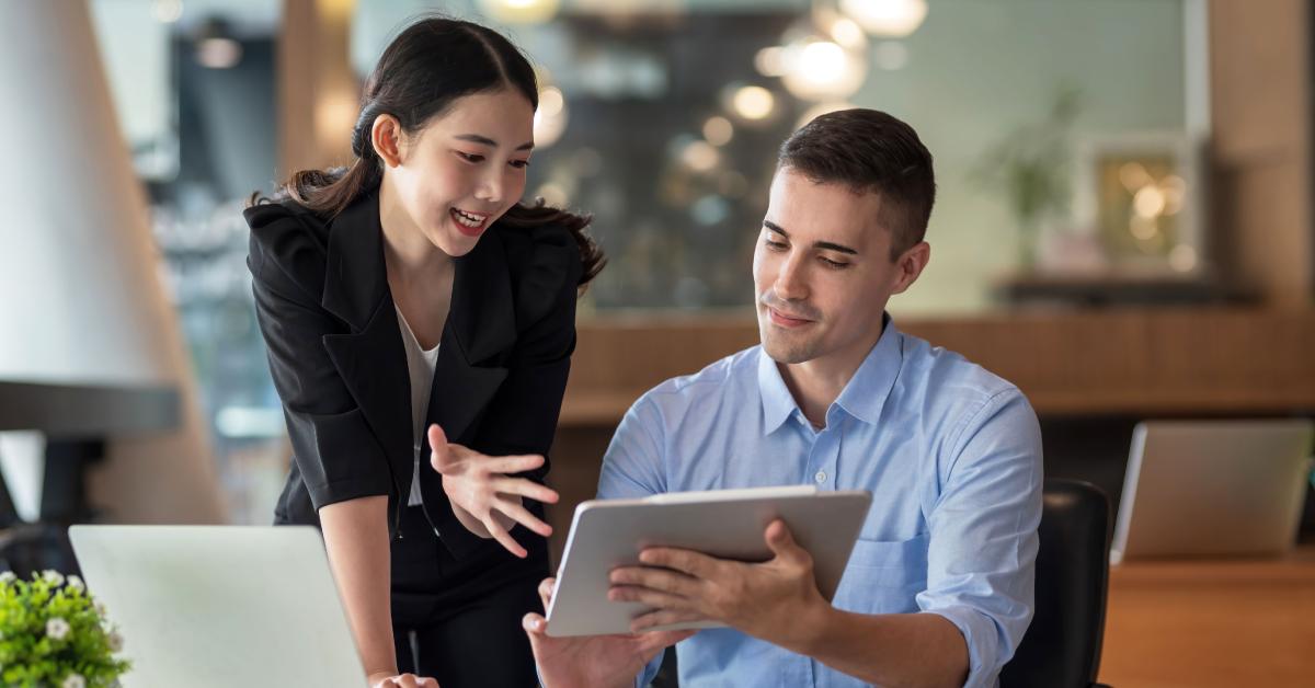 Business people working on a tablet.