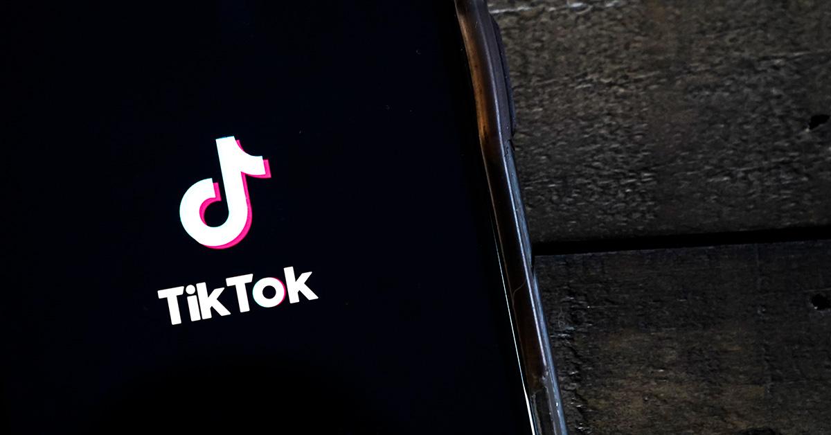 A TikTok logo on a phone screen. 