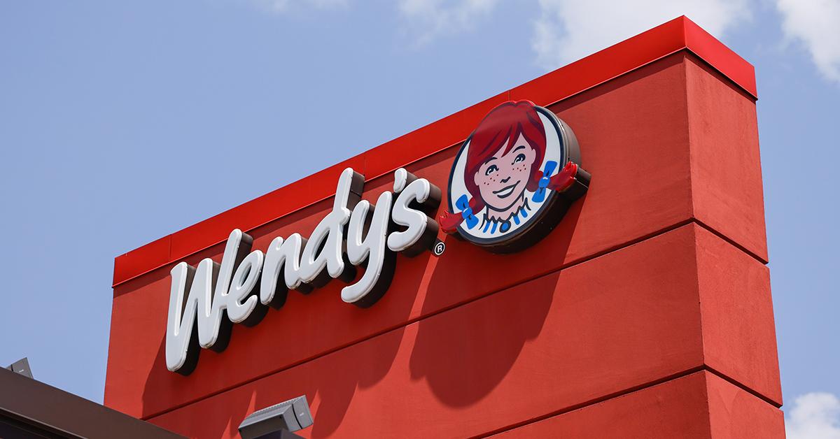 A Wendy's sign on a Wendy's resturaunt.