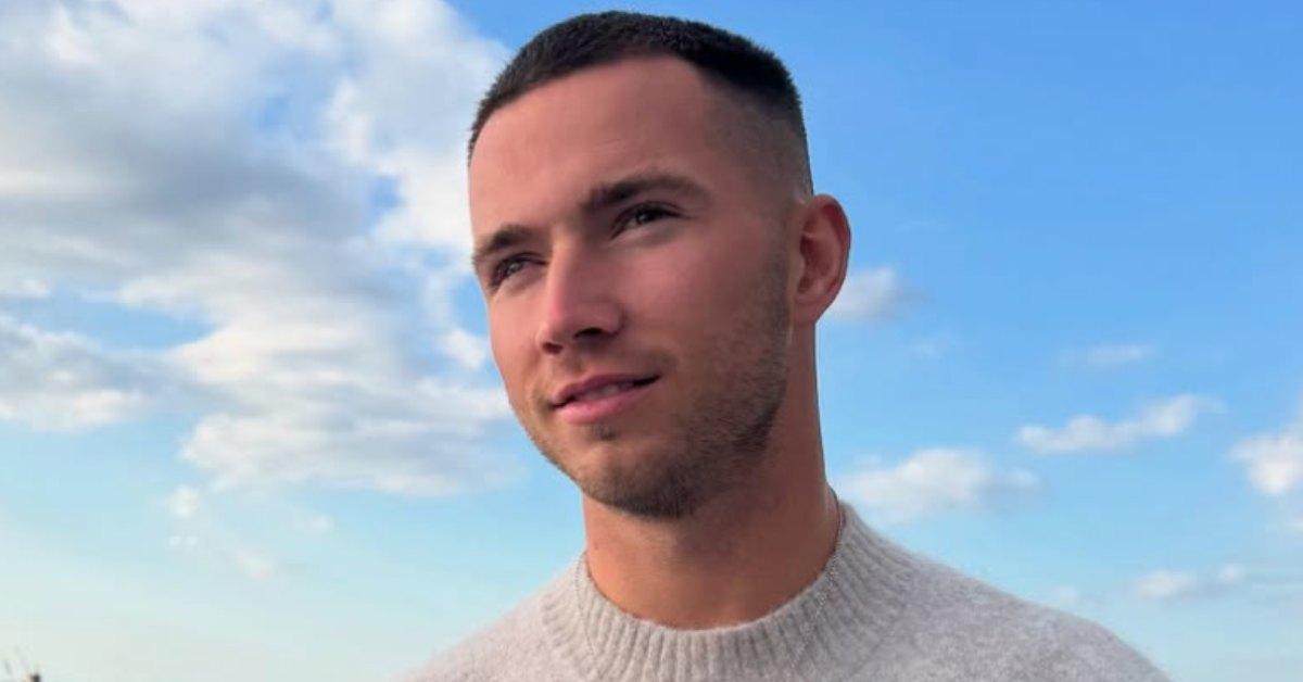 Ron Hall from 'Love Island' on a balcony.
