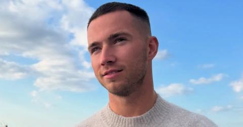 Ron Hall from 'Love Island' on a balcony.