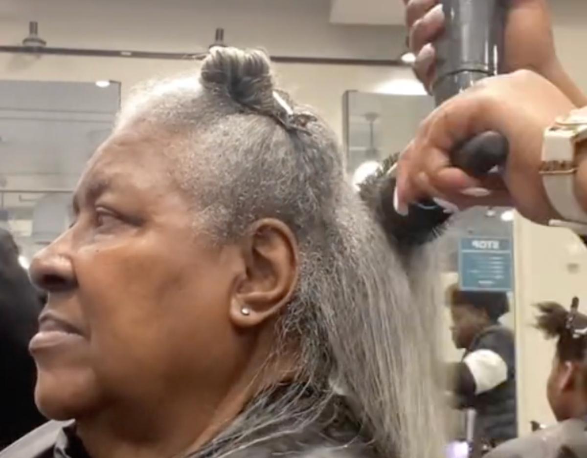 TikToker Niecy doing a client's hair in cosmetology school