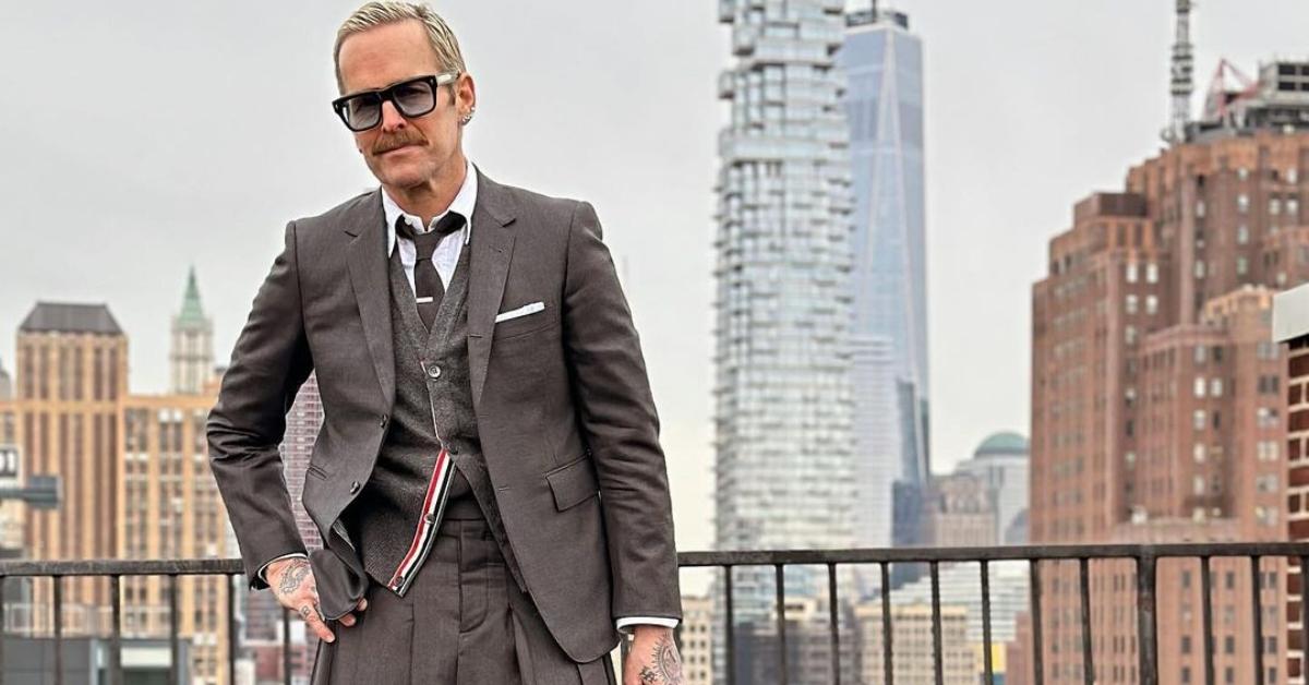 Bob Harper on a rooftop patio in a kilt