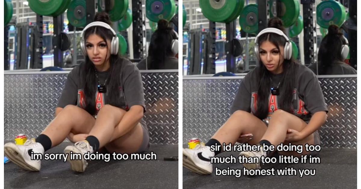 A woman sits at the gym after being interrupted by a man while working out